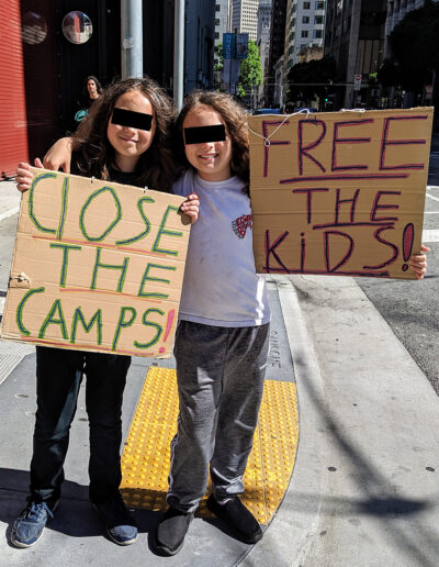 Two kids protesting ICE detention camps